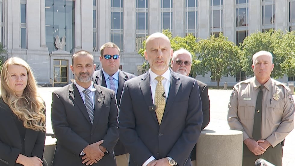 Assistant U.S. Attorney Joshua Wendell and his prosecution team speak to reporters following...