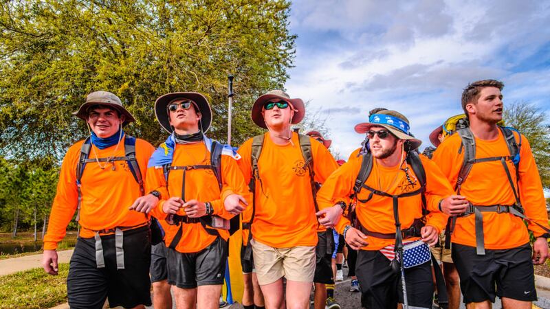 Alpha Tau Omega brothers walk arm-in-arm during the 2017 Walk Hard event. (Photo: Troy Today)