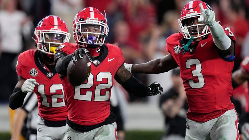 Georgia defensive back Javon Bullard (22) celebrates with Kamari Lassiter (3) and Julian...