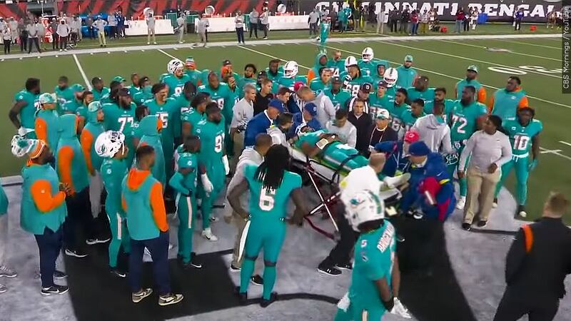 Miami Dolphins quaterback Tua Tagovailoa is seen being taken off the field via a stretcher...