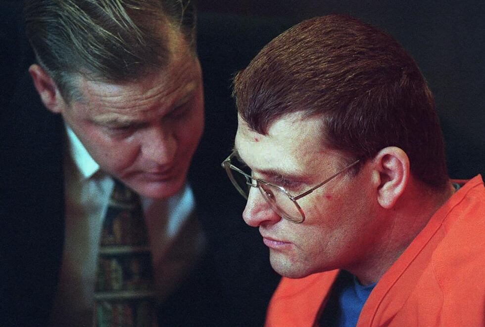 Accused murderer Keith Hunter Jesperson, dubbed the Happy Face Killer, right, listens to his...