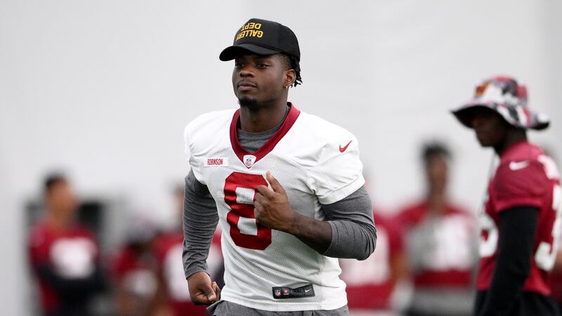 Washington Commanders running back Brian Robinson Jr. (8) runs during practice at the team's...