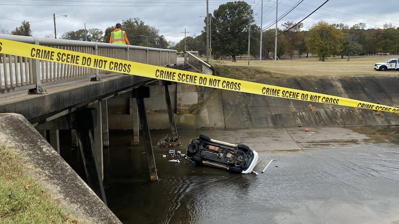 Four people were injured after a car flipped over a bridge and into a stream.