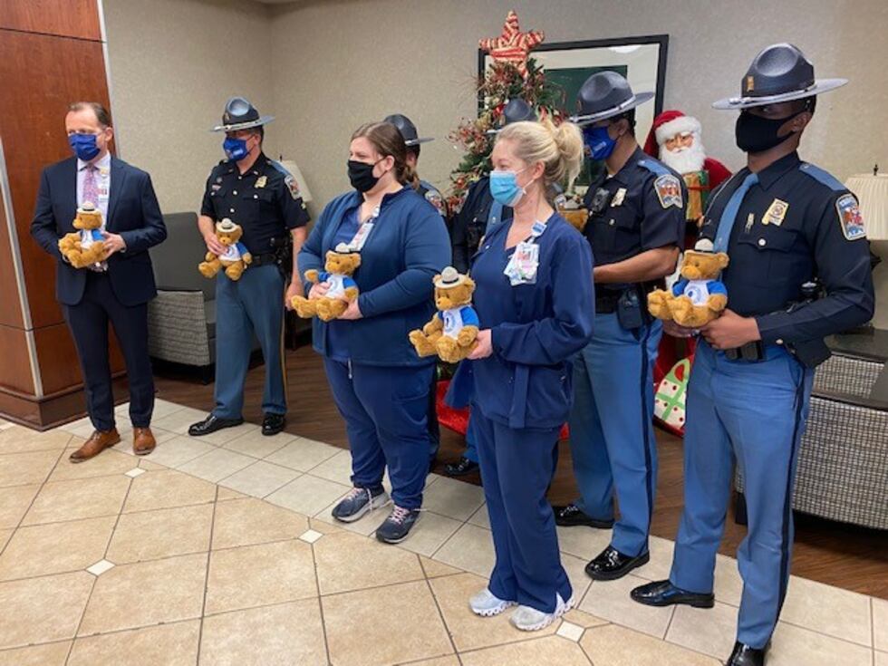 Troopers brightened young faces with teddy bears at DCH