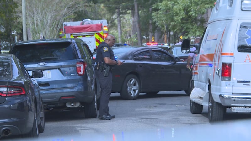 Police officer look for evidence after man is murdered in Dothan on October 24, 2019.