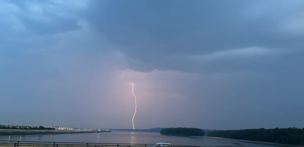 A lightning strike inside a distant thunderstorm.