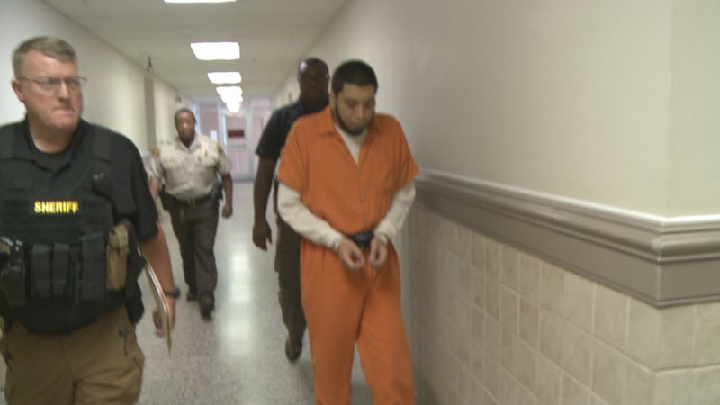 Rolando Castillo, Jr. is led from a Houston County courtroom in this June 1, 2018 photo.