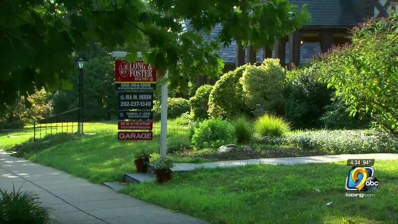 A for sale sign in front of a home.